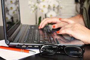 typing on laptop